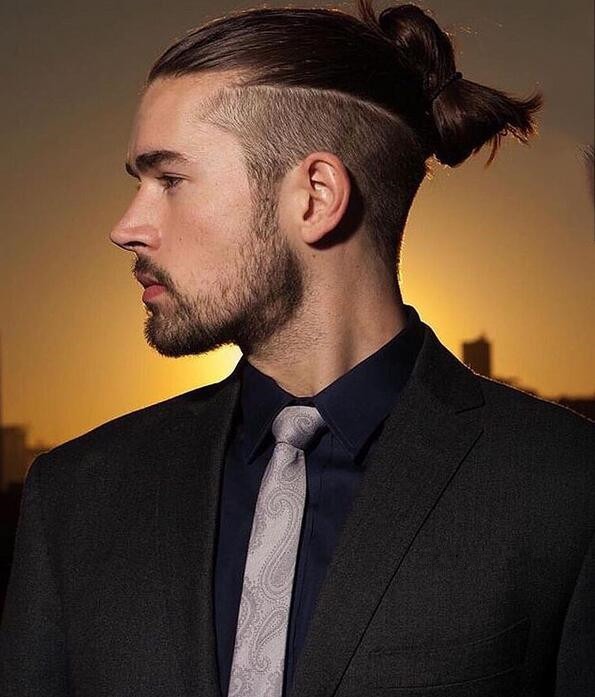 Slicked back disconnected undercut with a folded bun