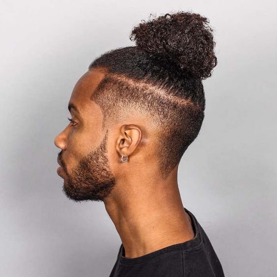 The Afro Textured undercut coupled with a man bun for black guys
