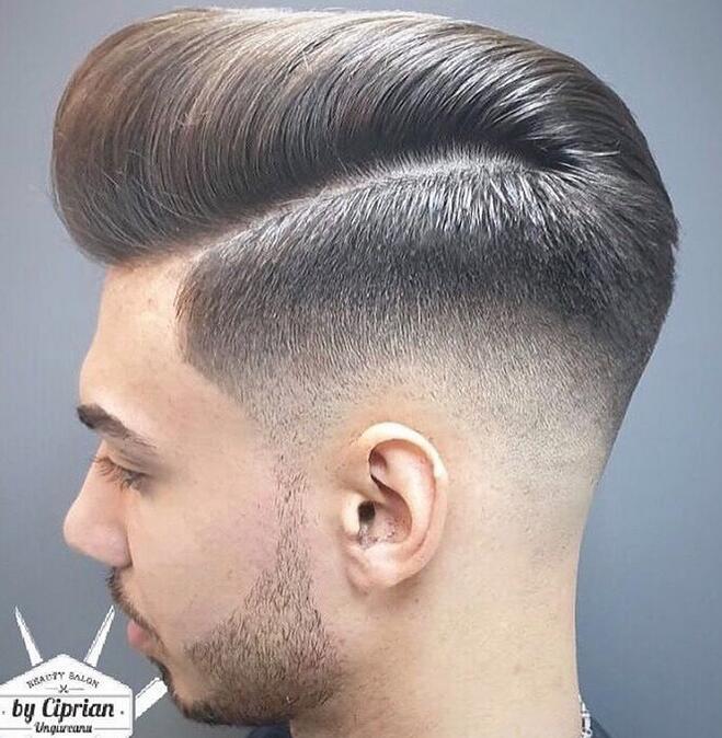 A Mid Fade with a large pompadour