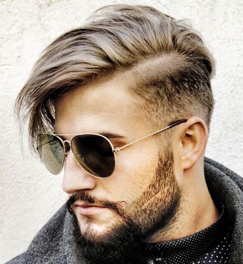 Mid Fade hairstyle with hair swept to the side