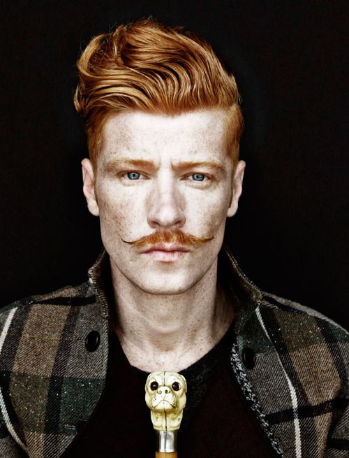 A quiff haircut with a mustache