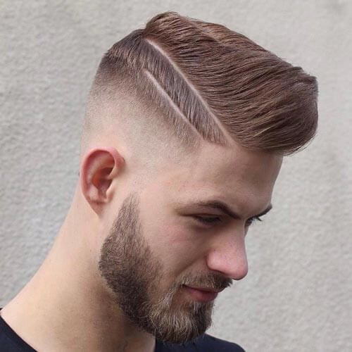 Mid-length pompadour hairstyle with faded sides and line cuts