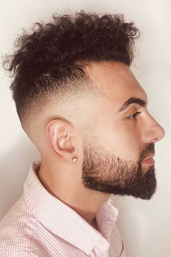 Pompadour fade haircut for men with curly hair