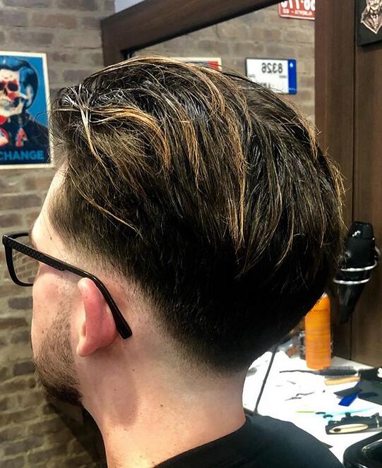 Pompadour haircut with an undercut fade