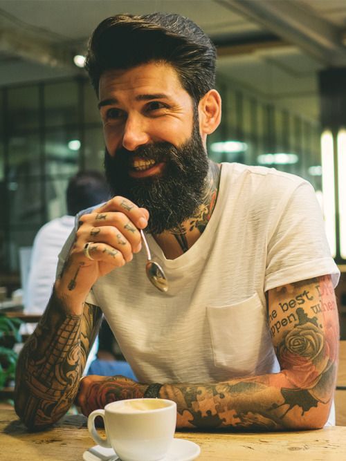 Quiff hairstyle with a full beard