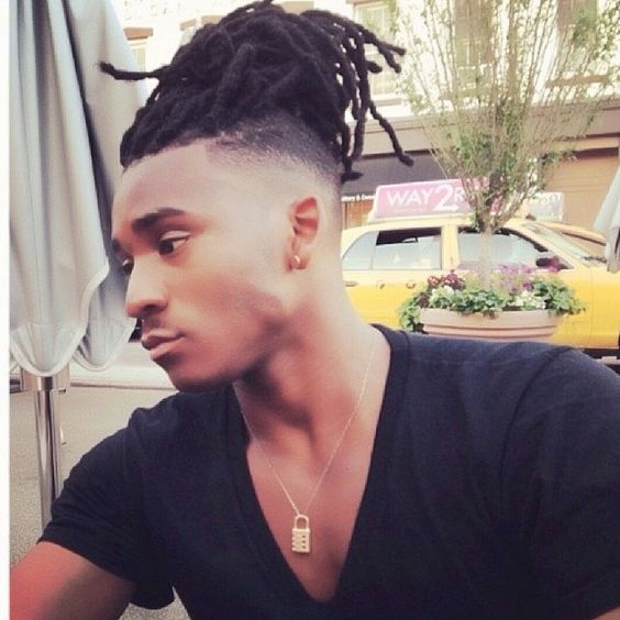 Dreadlocks and fade with a high top haircut