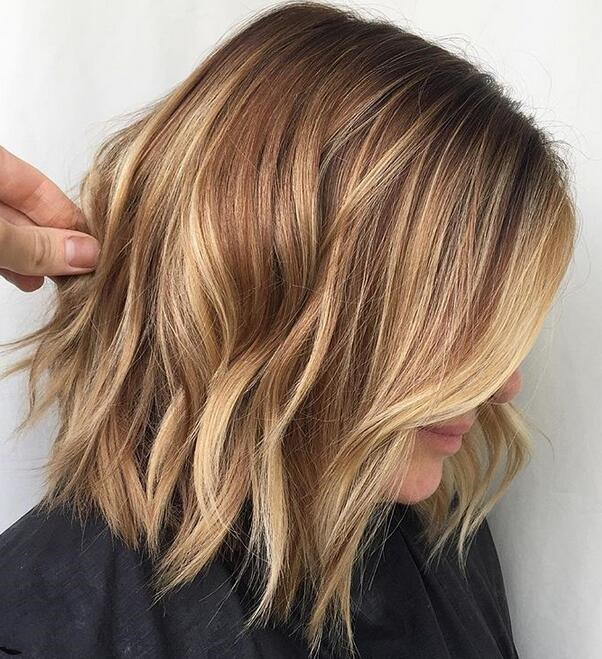 A choppy cut with caramel highlights