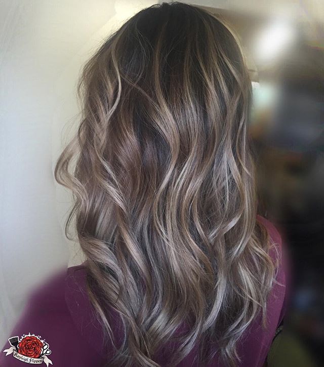 Ash blonde highlights on wavy hair