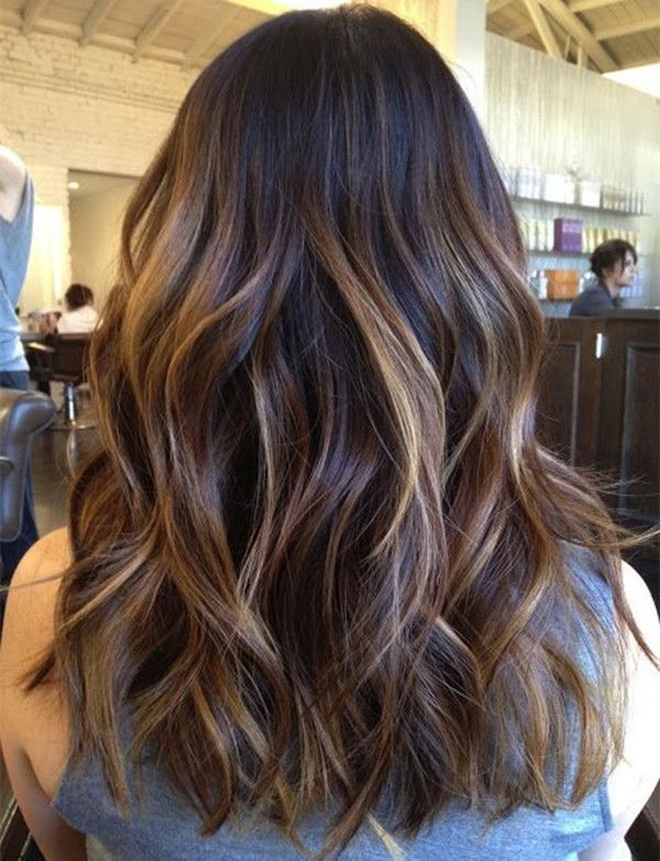 Mid-back length dark hair with highlights