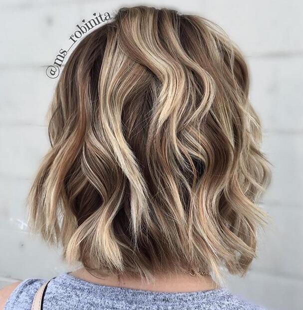 Short dark brown hair with blonde highlights