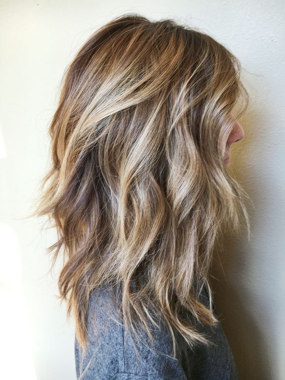 Pale blonde balayage on layered dark hair