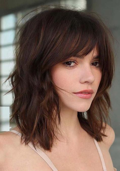 Layered Hairstyle with Side-Swept Bangs