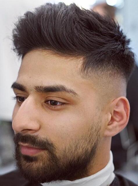 Low Taper Fade with a Brushed Up Hairstyle